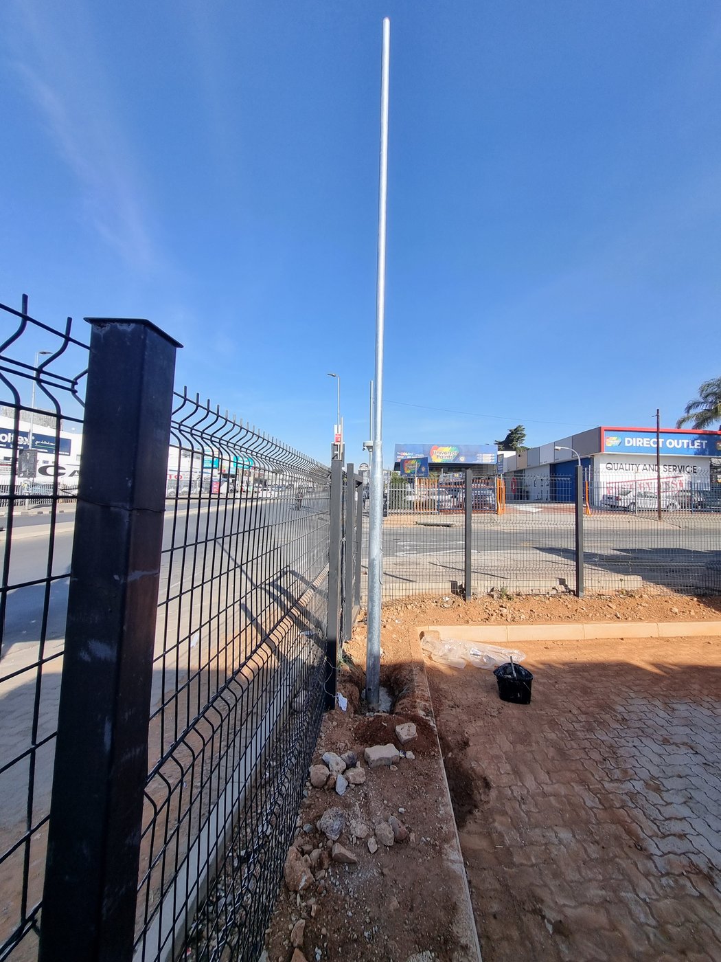 Electrical junction box installed on a steel pole at an Ultra Liquors site
