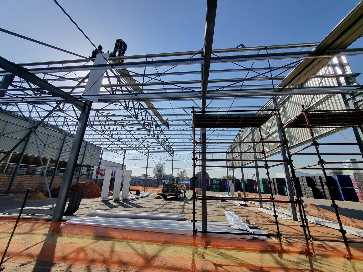 Sputnik Energy team working on the steel roof structure of a new commercial build